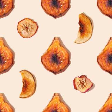 Autumn seamless pattern. Dried apple and pear slices close up on a beige background with a shadow. Seamless pattern. Healthy food, vitamins concept. Green living and eco-friendly products