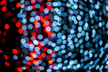 Blurred traces of lights and spots. Background full of unfocused colored lights.