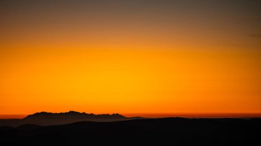 The Tatra Mountains seen from the Polonina Carynska (Bieszczady, Poland). Temperature inversion in the mountains. Distance about 170 km.