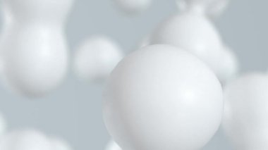 Fluid abstract white spheres that float and blend with looping animated motion 