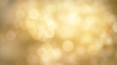 Sonbahar ya da Noel süslemeleri için kahverengi bir bokeh ışığın bulanık arkaplanı döngülenmiş