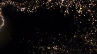 Şeffaf bir arkaplanda altın parçacıklardan oluşan kuyruğu olan parlak bir Noel yıldızının döngü animasyonu. Alfa kanallı Quicktime Prores 4444 kodlayıcı.