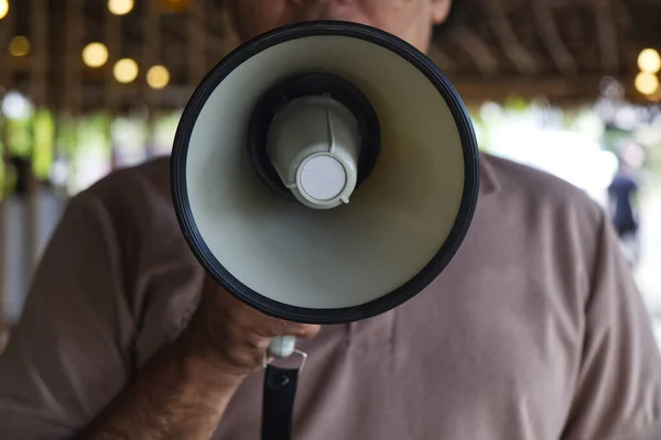 Man Using a Megaphone to Proclaim or Announcement Something with Very Loud Voice.