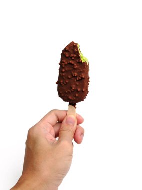 A man holding a green tea ice cream bar coated in chocolate with a bite taken out, set against a isolated white background. clipart