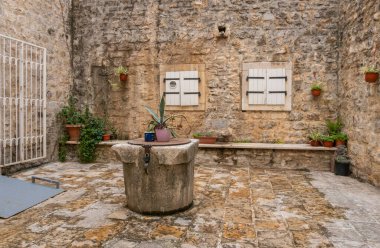 Ancient water well in the old town of Budva, Montenegro