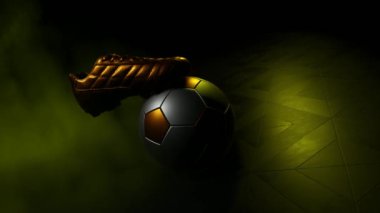 Altın kramponlarla eşleştirilmiş bir futbol topu..