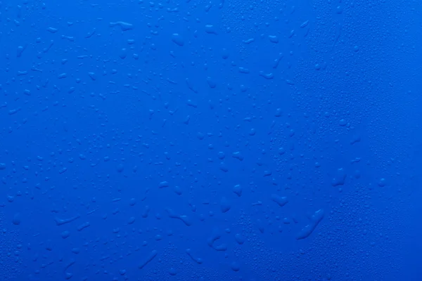 Капли Воды Голубом Фоне Пластиковой Поверхности — стоковое фото