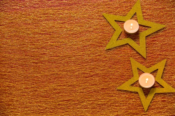 黄金の星とキャンドルのクリスマスの背景 — ストック写真