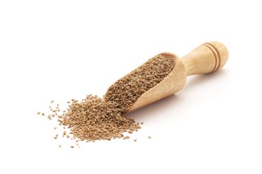 Front view of a wooden scoop filled with Organic Carom seeds (Trachyspermum ammi) or Ajwain. Isolated on a white background. clipart