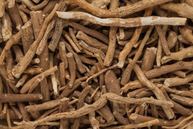 Organic Ashwagandha (Withania somnifera) roots. Macro close up background texture. Top view. clipart