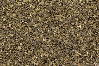 Organik Yeşil Çay (Kamelya sinensis) Çay poşeti kesimi, kuru izin, Makro arka plan dokusunu kapat. Üst görünüm.