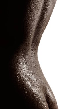 Tempting silhouette of wet back and butt of an asian woman isolated over white background.