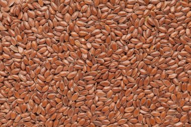 Organik keten tohumları (Linum usitatissimum) veya tam çerçeve arkaplanda keten tohumu. Mikro Kapanış, Üst Görünüm.