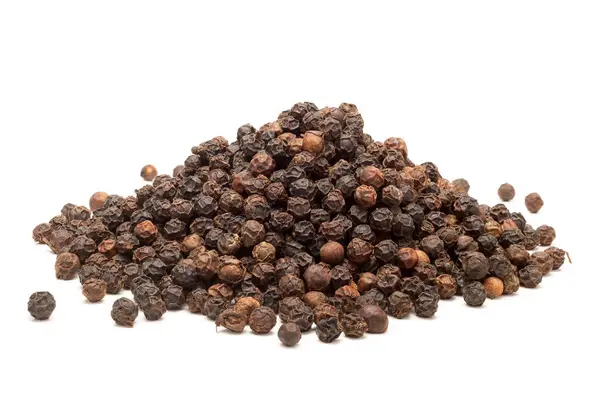 Stock image Close-up of Dry Organic Black pepper (Piper nigrum), isolated on a white background. Front view