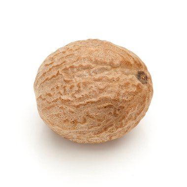 Macro closeup of Organic Nutmeg Seed or Jaiphal (Myristica fragrans) isolated on white background. clipart