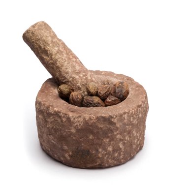Organic Inknut or Harr (Terminalia chebula) in mortar with pestle, isolated on white background. clipart