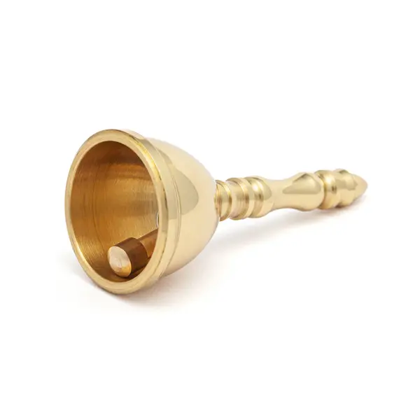 stock image A brass puja bell (Pooja Ghanti, Ghanta) used for rituals at home and temple, isolated on a white background, symbolizing devotion and spirituality.