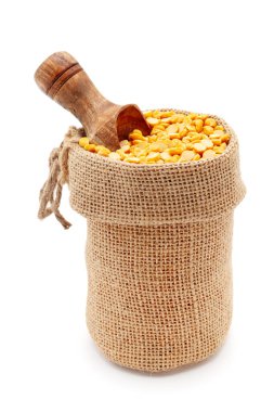 Close-up of Organic Bengal Gram (Cicer arietinum) or split yellow chana dal, in a jute bag with a scoop, Isolated on a white background. clipart