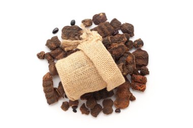 Close-up of organic Shikakai (Acacia concinna) fruits in a jute bag on a heap of shikakai fruits, isolated on a white background. clipart