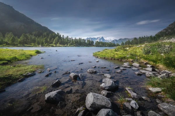 stock image The Arpy Lake (Lago d'Arpy in italian) and the The Grandes Jorasses mountain in the Mont Blanc massif in the background. Morgex, Aosta Valley region, Italy