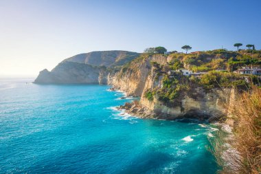 Ischia Island, the sea and the rocky coast near Sant'Angelo. Travel destination in Phlegraean Islands archipelago near Gulf of Naples in Campania region, Italy clipart