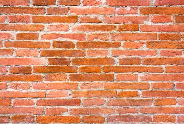 Kırmızı tuğlalı Rustik Toskana duvarı geleneksel zanaatkarlık sergiliyor. Mimari, tarihsel ve doku tasarım projeleri ve arka planlar için mükemmel.