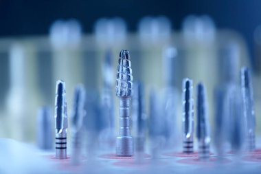 Rotary Dentistry Tools. Dental tools, tongs of various shapes. drill, dentist, dentistry, medical background. Shallow depth of field