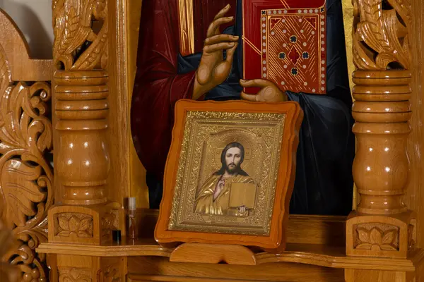 Orthodox icon on a church pulpit. When worshipers enters the church they will kiss this icon and cross themselves.