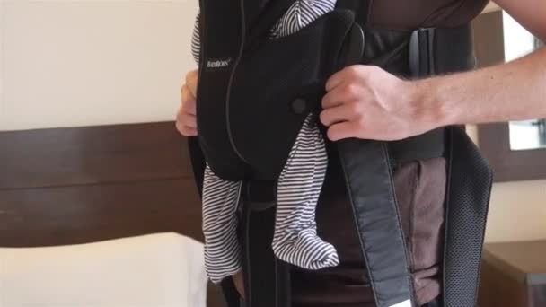 Man Holding Baby Using Carrier Handheld — Stock Video