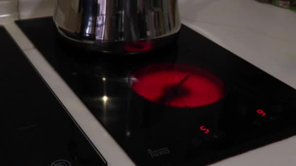 Putting Kettle Electric Stove While Hot Medium — Stock Video