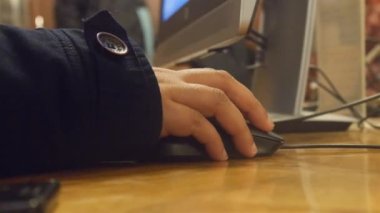 Hand Of Woman With Jacket Using Computer Mouse - Static