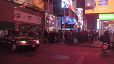 Car Passing By In Front Of Crowded Street - Pan - Right To Left