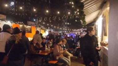 Christmas Market With Lights And People - Slide - Right To Left