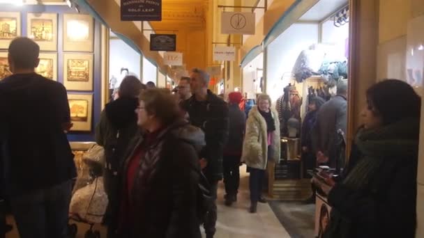 People Walking Surrounded Shops Pan Right Left — Stockvideo