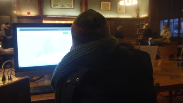 Woman Bonnet Jacket Using Library Computer Slide Right Left — Vídeo de Stock