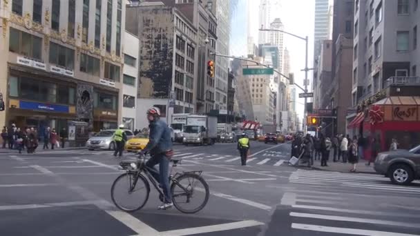 Man Crossing Large Street Bicycle Pan Right Left — Wideo stockowe