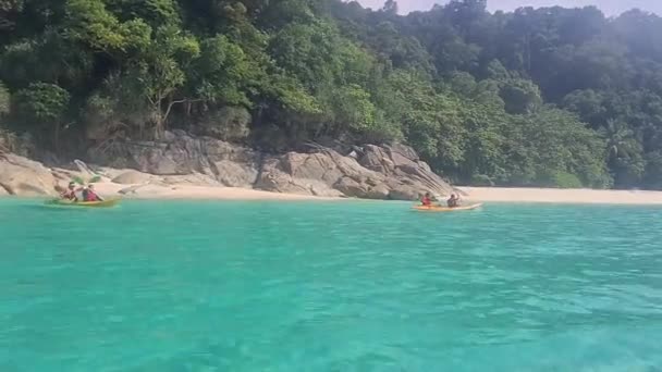 Two Men Rowing Boat Clear Sea Nearby Beautiful Greenery — Stock Video