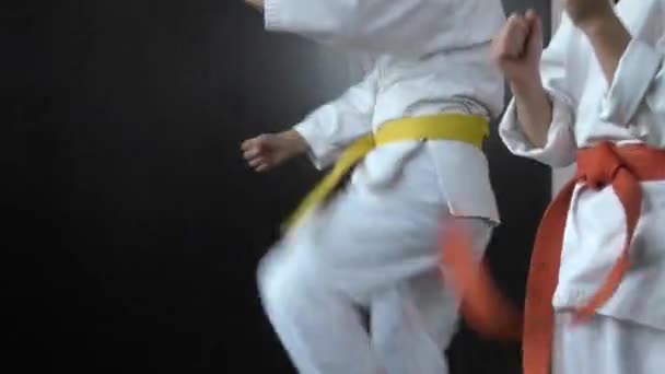 Athletes Yellow Red Belts Practice Kicking — Stok video