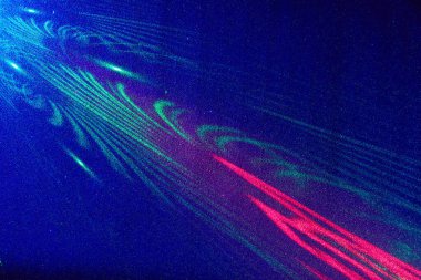 Mavi bir arka planda, yeşil ve parlak kırmızı desenli ışık desenleri