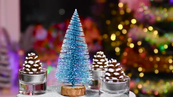 Close Blue Christmas Tree Surrounded Pine Cones Rotating Stand — Stock Video