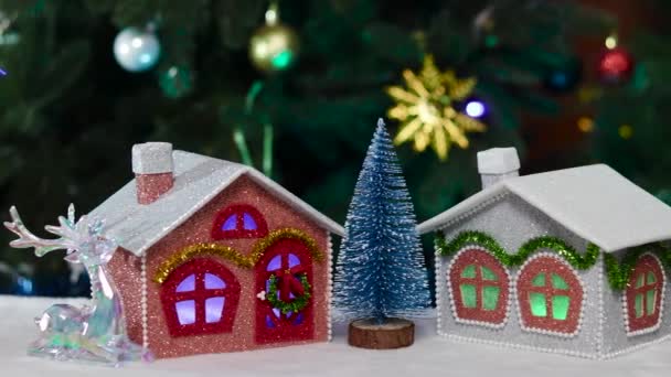 Close Small Christmas Trees Standing Gray Red Pink Houses — Stock Video
