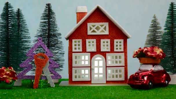 화려하게 빛나는 열쇠가 크리스마스 지붕에 꽃이있는 차가있는 근처에 클로즈업 — 비디오