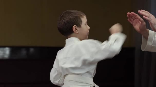 Little Athlete White Belt Trains Punches Palms Trainer Video Clip