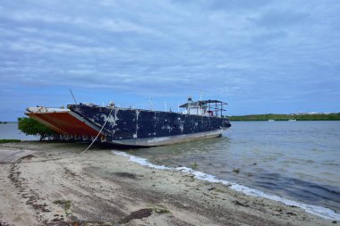 North Creek, Grand Turk - 4th February 2024:An old landing craft beached in North Creek clipart