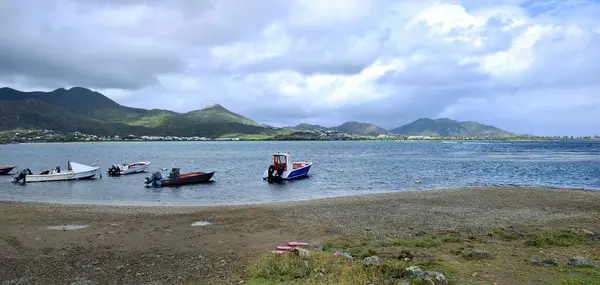 stock image Saint Barthelemy Channel, St Maarten - 2nd February 2024:Fisherman boats at anchor after the daily catch is completed