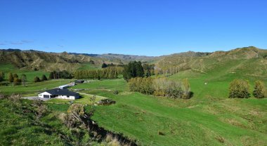 Large farm house in the countryside of New Zealand clipart