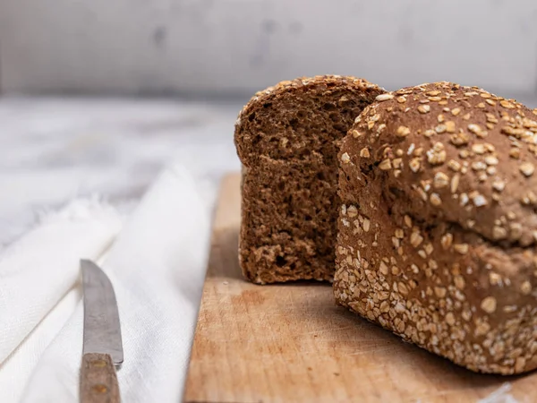 stock image Freshly baked bread on grey concrete background. 