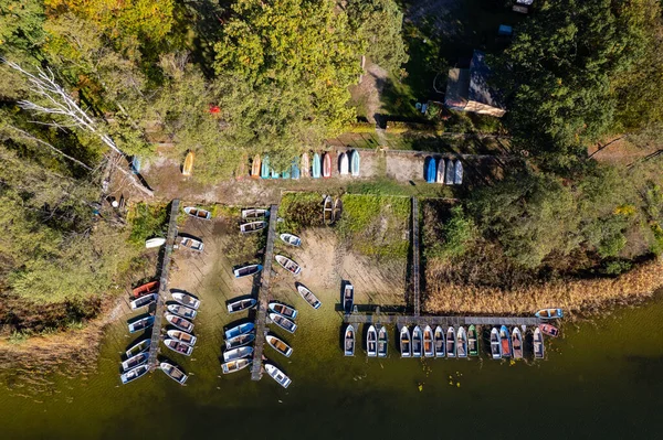 Drone footage of a pier with boats lined up in Lake. Germany.