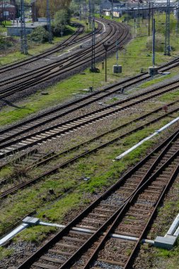 Railway outdoors on beautiful summer day. Industrial landscape with rails and railway. clipart