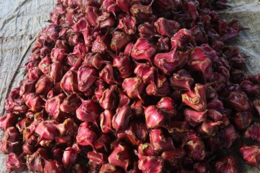 Water Chestnut Trapa natans fruit on shop for sell are cash crops.have sugars, fiber, vitamin B, potassium, copper, manganese, protein.can treat allergies, swelling of hands, feet, diarrhea, abdominal clipart